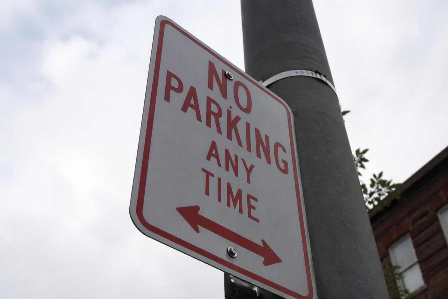 tilted street sign photograph